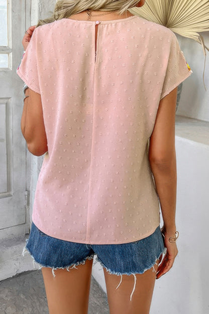 Swiss dot crochet patchwork shirt in blush pink back view with keyhole button and frayed denim shorts
