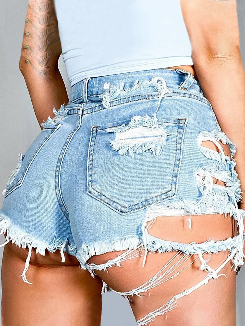 Trendsi Women's distressed denim shorts. Light wash high waist frayed hem and ripped side panels for summer