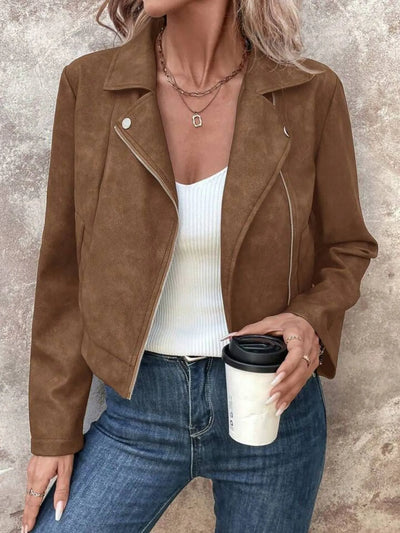 Trendsi women's suede moto jacket in brown worn with white ribbed tank and blue jeans holding coffee cup