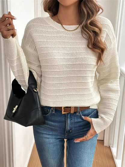 Front view of Trendsi Bow-Back Knit Top in cream on model paired with jeans and black shoulder bag