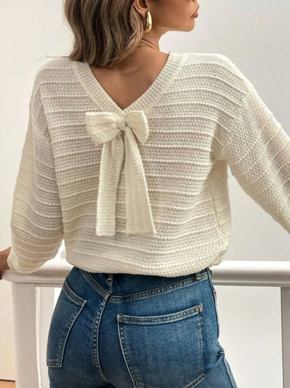 Trendsi Bow-Back Knit Top cream textured V back sweater with bow tie detail worn with blue jeans