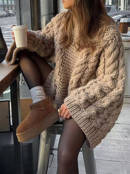 Cozy Cable Knit Sweater in beige worn with a cup of coffee for a stylish winter outfit