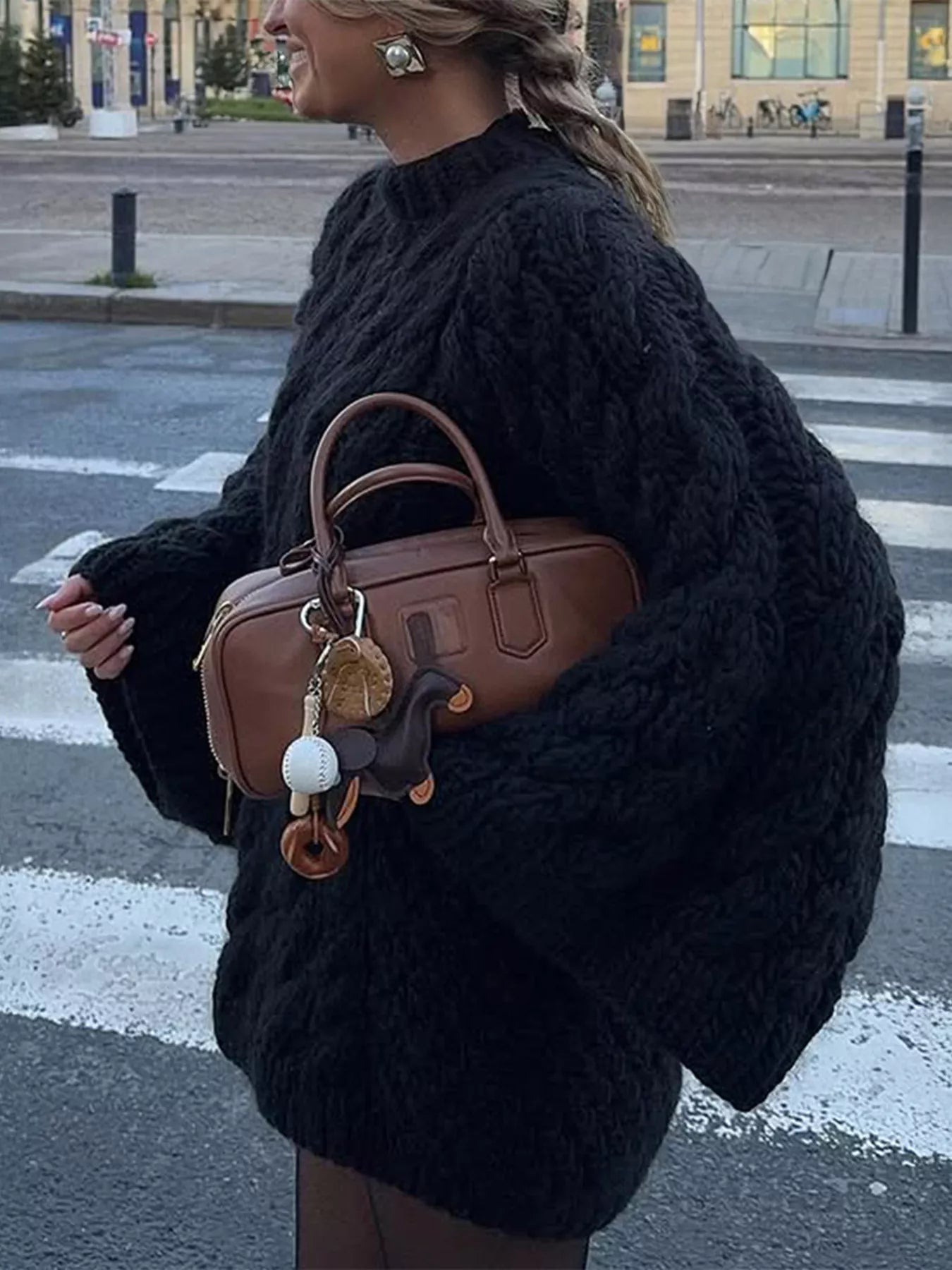 Trendsi Cable Knit Sweater in Black worn casually with a stylish handbag