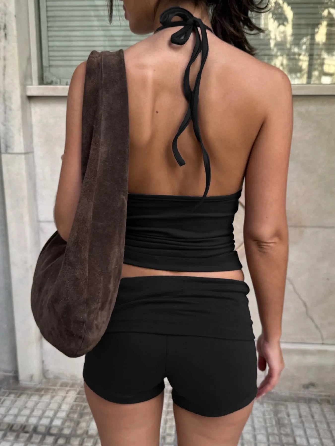 Trendsi Cami and Shorts Set in black, featuring a halter top and matching shorts for a stylish summer look