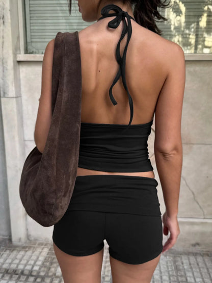 Trendsi Cami and Shorts Set in black, featuring a halter top and matching shorts for a stylish summer look