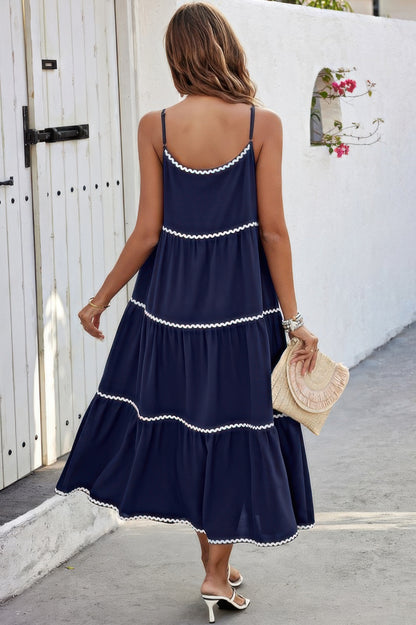 CCWHOLESALECLOTHING A Line Ankle Dress navy tiered sundress back view with white scalloped trim and straw hat