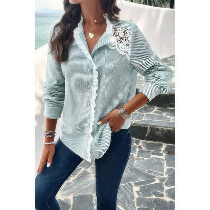 Woman wearing light green striped Button Front Shirt with lace shoulder detail and ruffled placket over jeans