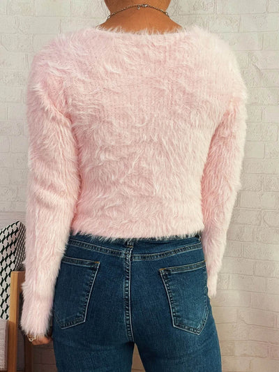 Trendsi Cozy Knit Sweater back view light pink fuzzy long sleeve cropped sweater paired with blue jeans