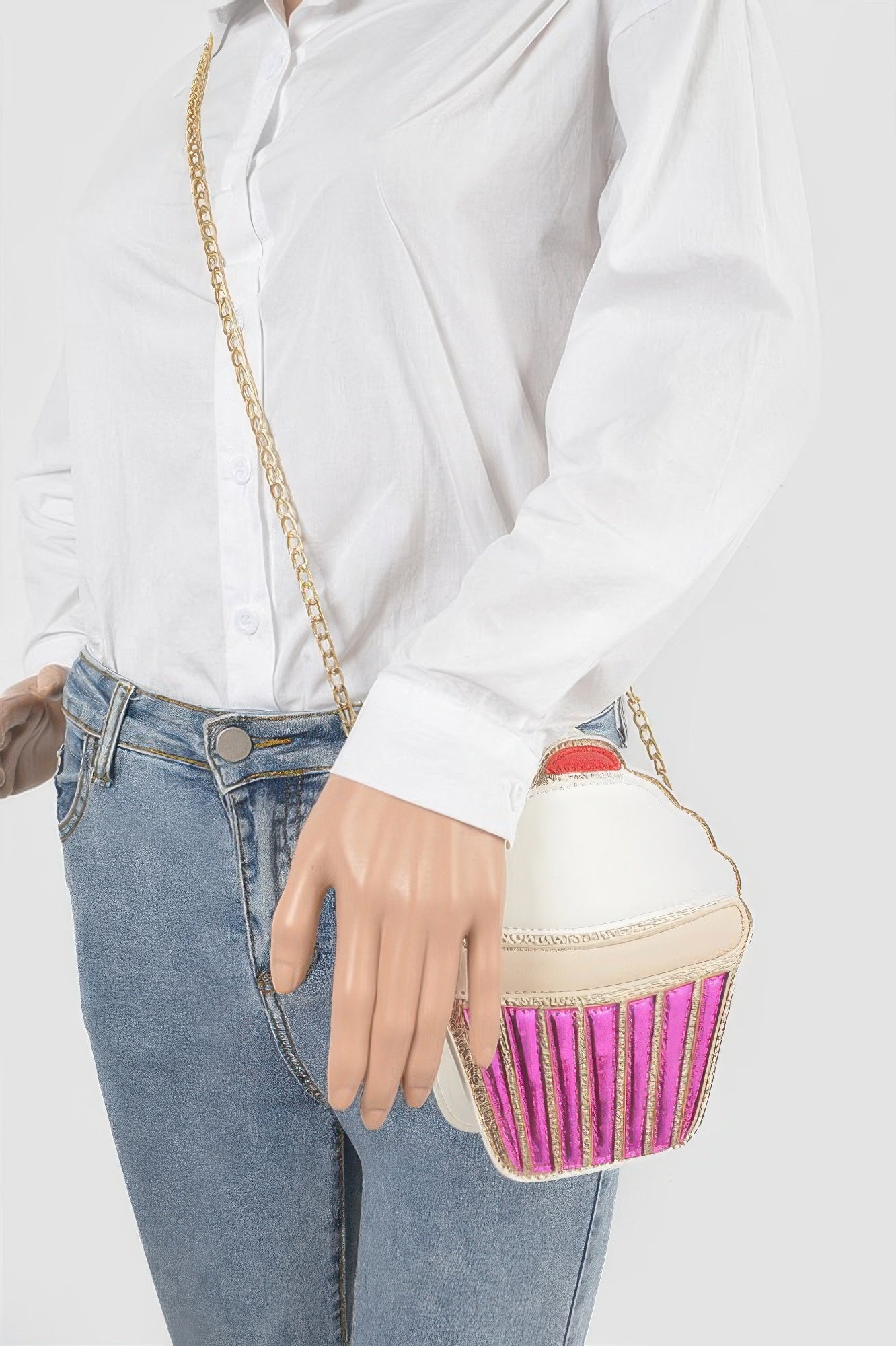 Clutch Handbag cupcake shaped crossbody with pink glitter base white top gold chain strap worn with white shirt and jeans