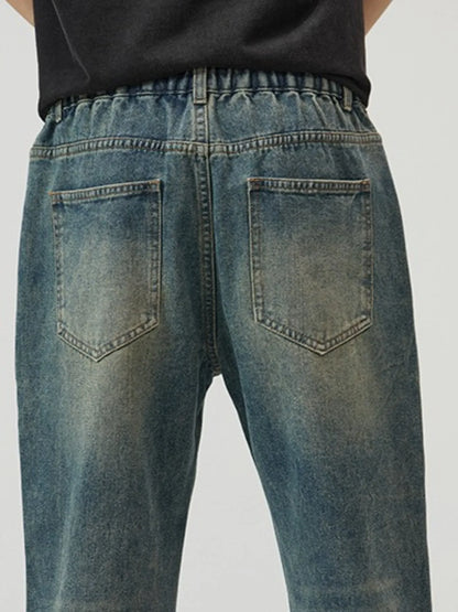 Trendsi men's plus size straight leg jeans faded blue wash back view with elastic waistband and patch pockets