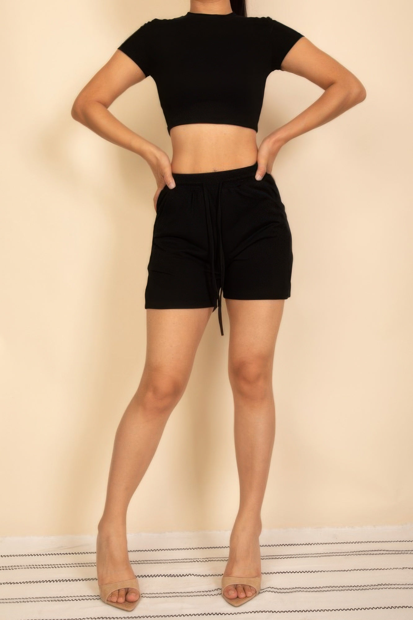Black Drawstring Shorts Set featuring a cropped top and comfortable shorts for a casual look