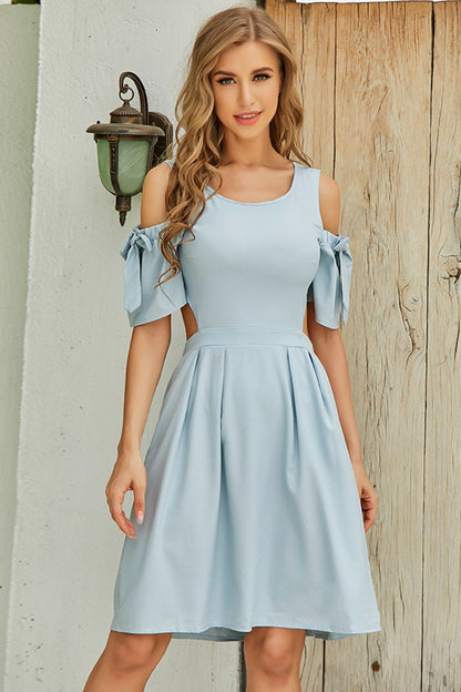 Light blue dress with stylish cutout and bow sleeves perfect for casual outings