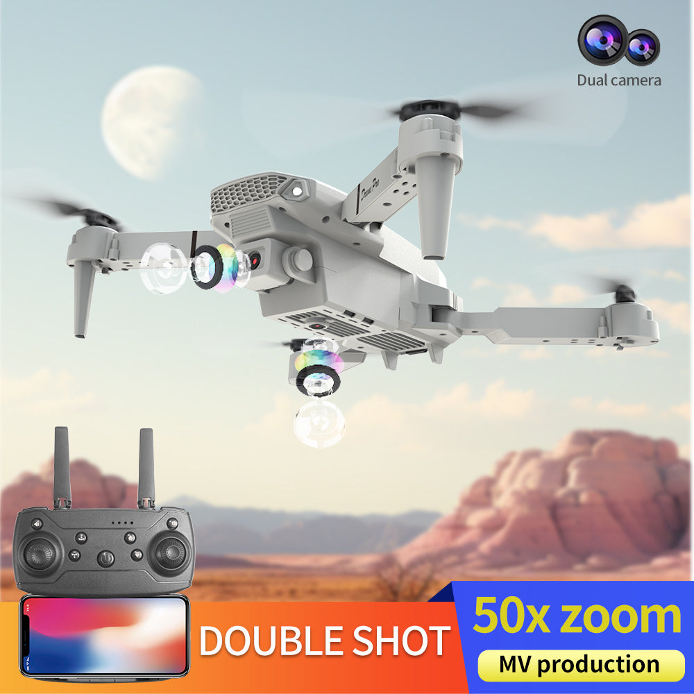 Trendsi E88 dual camera drone in white with remote and smartphone showing 50x zoom over desert landscape