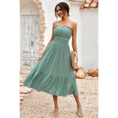 Model wearing Elasit Waist Ruffle Dress in sage green strapless midi with smocked elastic waist and ruffle hem