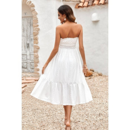 Back view of woman in white strapless Elasit Waist Ruffle Dress midi eyelet summer dress outdoors