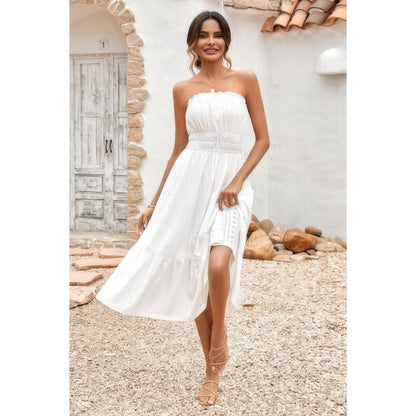 Model wearing Elasit Waist Ruffle Dress white strapless midi with smocked elastic waist lace panels and side slit