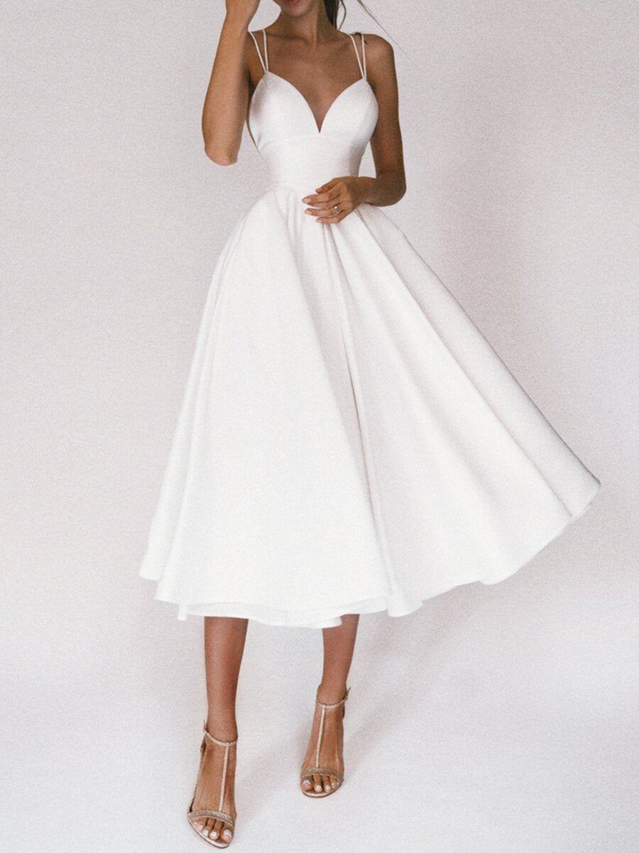 Elegant A-Line Maxi Dress in White with Spaghetti Straps and Flowing Skirt for Formal Events