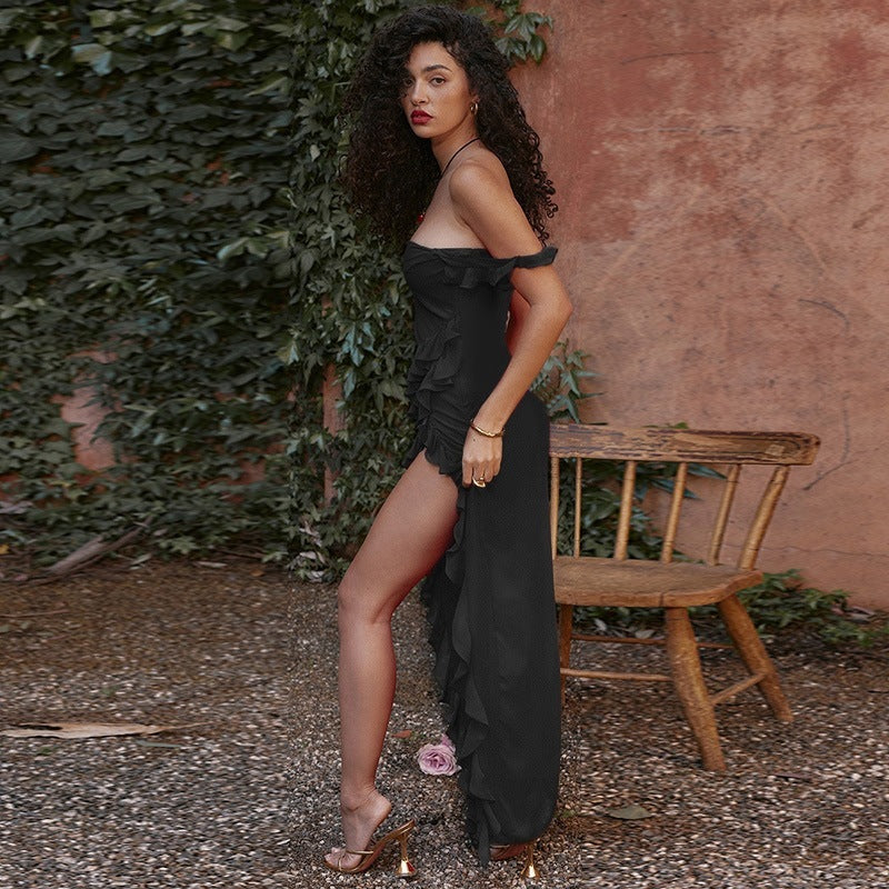 Elegant Ruffled Evening Maxi Dress in black worn by model with curly hair and high slit