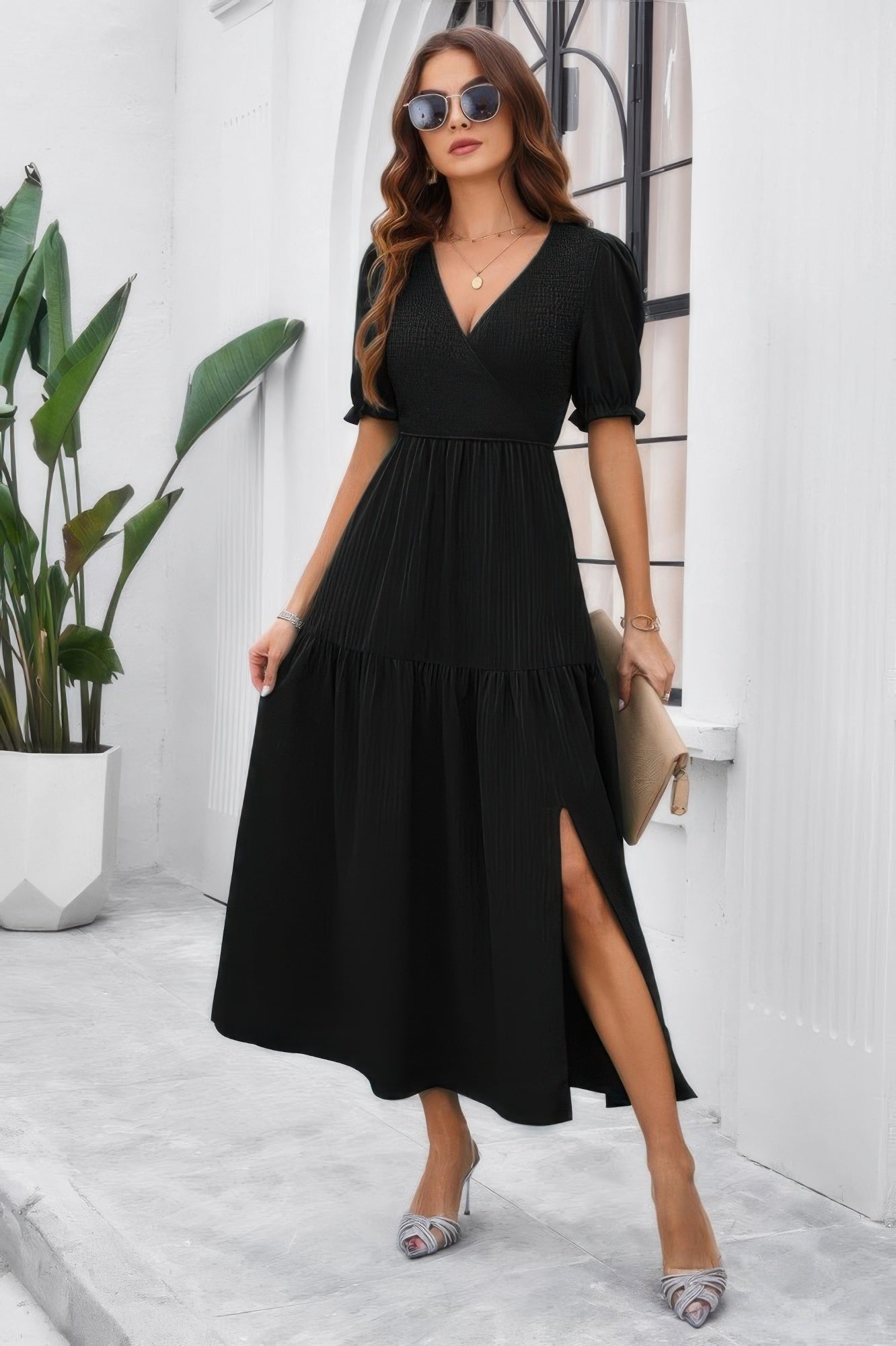 CCWHOLESALECLOTHING model wearing a black High Waist Puff Sleeve Dress with V neck side slit