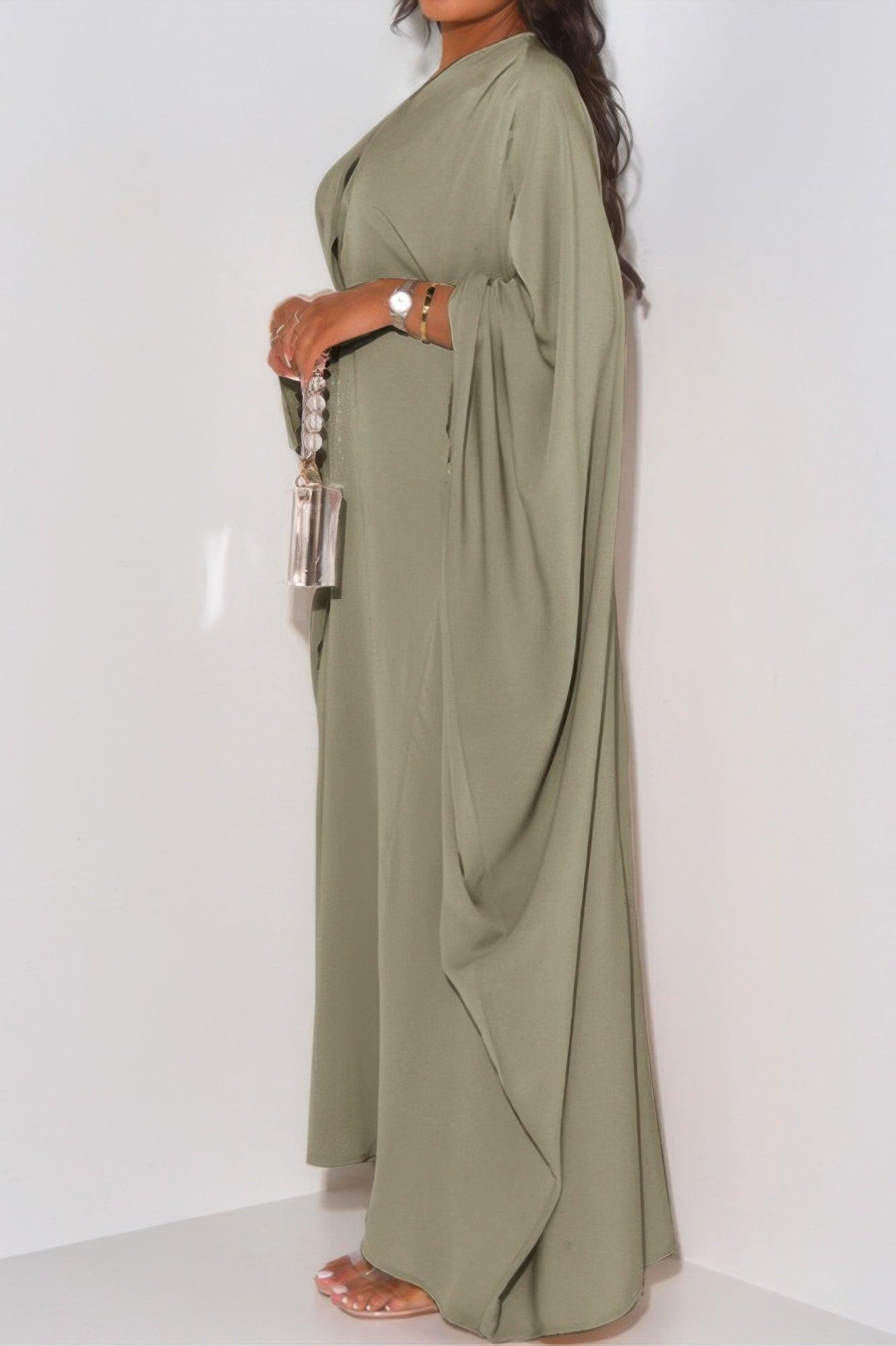 CCWHOLESALECLOTHING side profile olive green loose fit v neck maxi dress with draped cape sleeves and clear bead bag