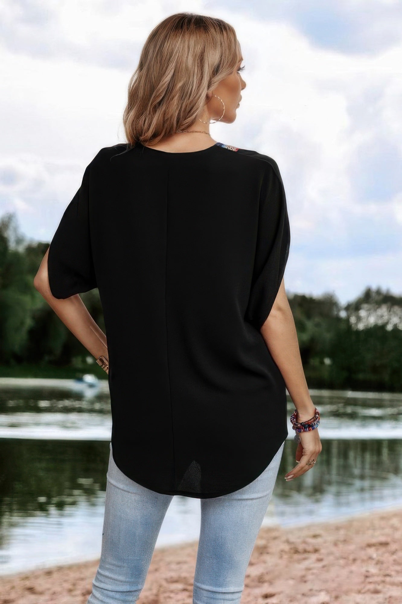 Back view of model wearing CCWHOLESALECLOTHING black boho v neck loose top by lake