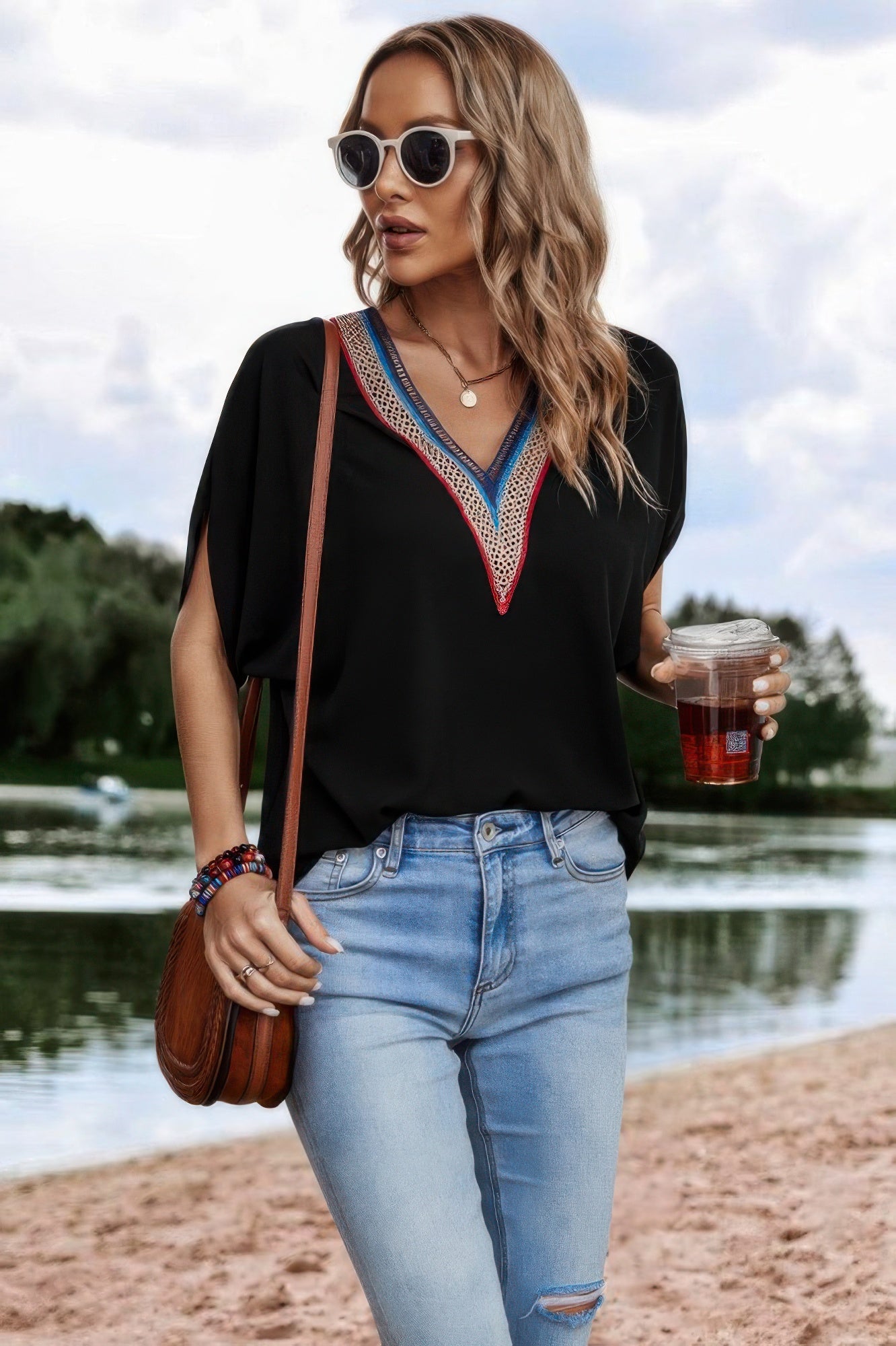 CCWHOLESALECLOTHING boho v neck loose top in black with embroidered V neckline, slit sleeves, styled with jeans
