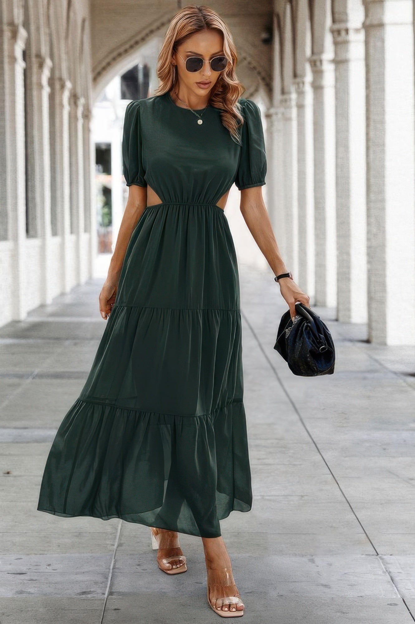 Model wearing dark green maxi Puff Sleeves Fit Dress with waist cutouts tiered skirt and black bag
