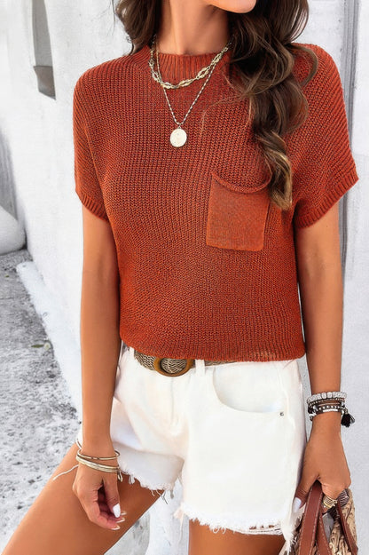Rust orange ribbed knit loose top with chest pocket styled with white frayed denim shorts and accessories