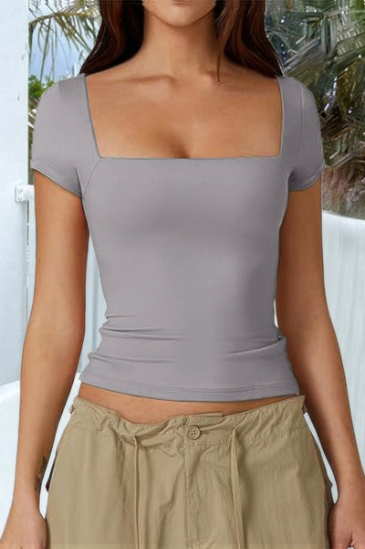 Fashions Envy gray square neck short sleeve shirt fitted bodice on model with casual khaki pants