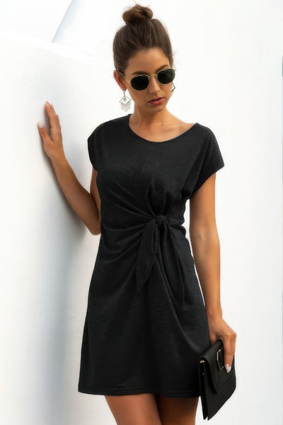 CCWHOLESALECLOTHING black short sleeve casual twist knot front dress with side tie worn with sunglasses and clutch