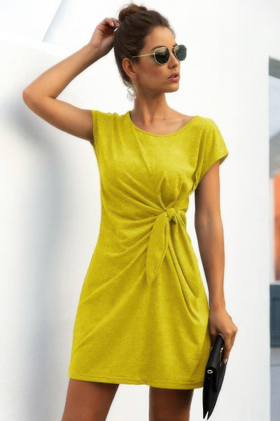 Model wearing CCWHOLESALECLOTHING lime green short sleeve casual dress with side tie twist knot front dress