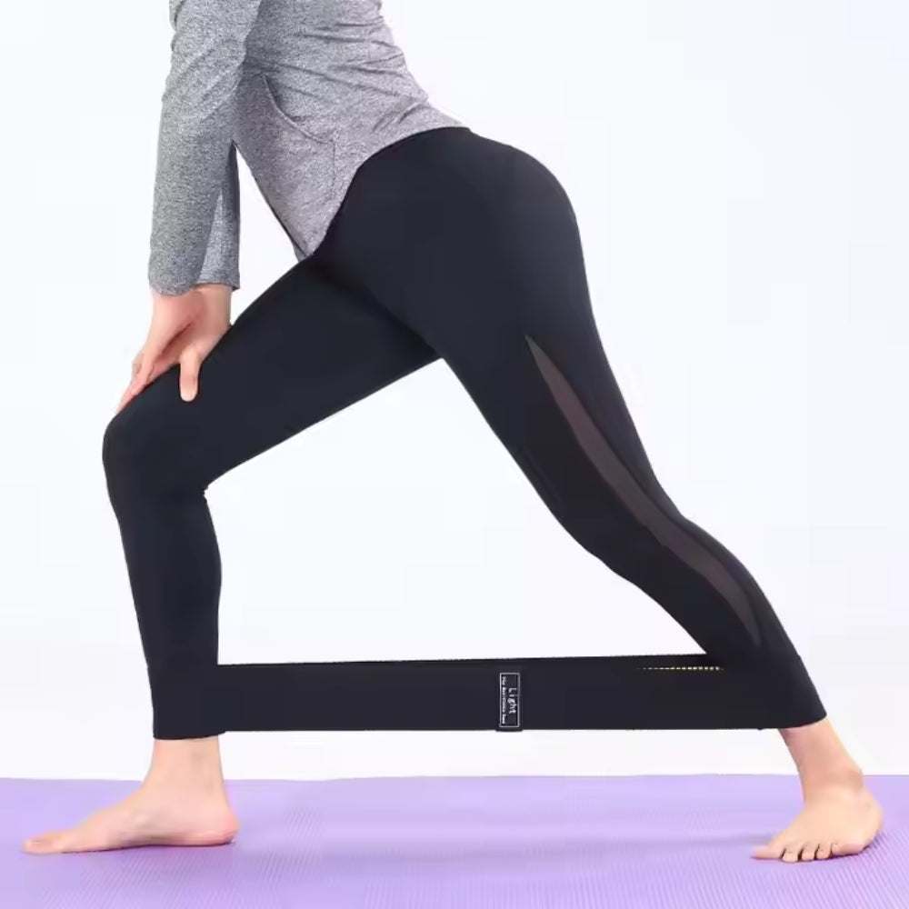 Fashions Envy Hip Booty Bands on woman wearing black leggings doing lunge on purple yoga mat for glute activation