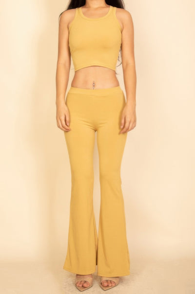 Flared Pants Set in mustard yellow featuring a cropped tank top and matching flared pants
