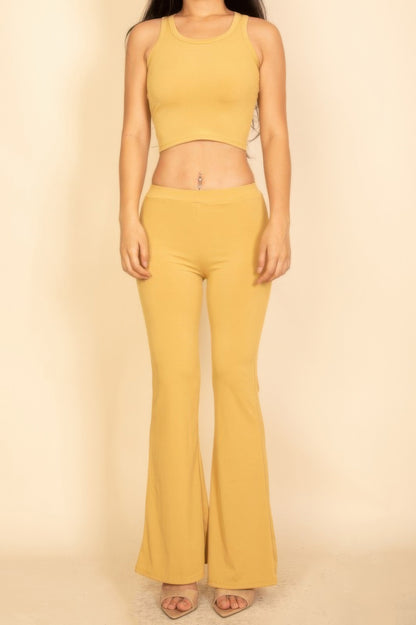 Flared Pants Set in mustard yellow featuring a cropped tank top and matching flared pants