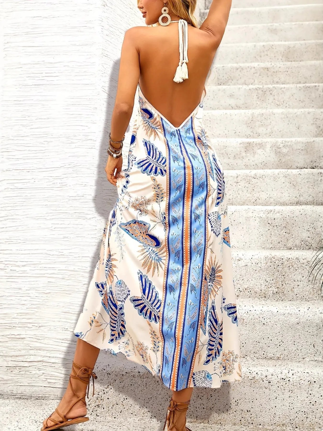 Back view of a Floral Print Maxi Dress with a deep V-back and tropical design, perfect for summer outings