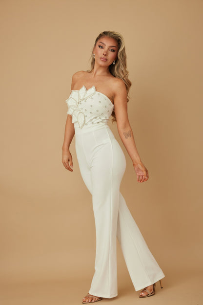 white rhinestone jumpsuit for women strapless embellished bodice with flared pants model wearing heels