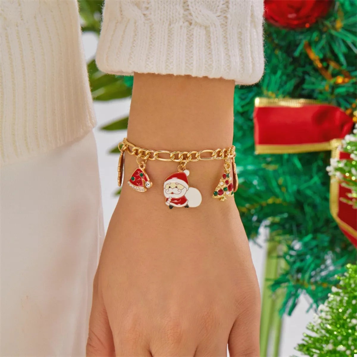 Gold-Plated Charm Bracelet featuring holiday-themed charms like Santa Claus and Christmas trees