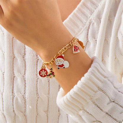 Gold-Plated Charm Bracelet with festive holiday charms including Santa, snowflake, and Christmas tree