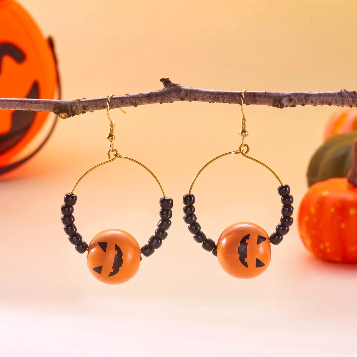 Trendsi Halloween Bead Earrings featuring orange pumpkin beads and black accents for festive style