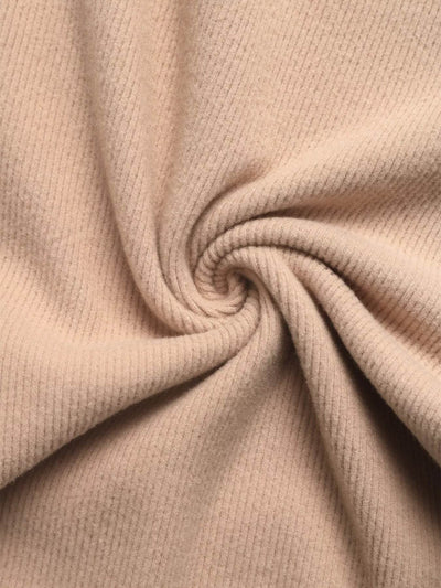 Soft and comfortable fabric close-up of a hoodie and pants set in a neutral beige color