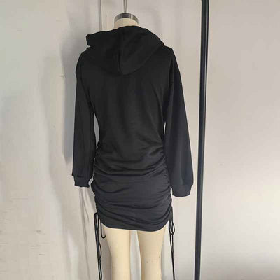 Back view of a black Hoodie Mini Dress with adjustable ruching and a relaxed fit