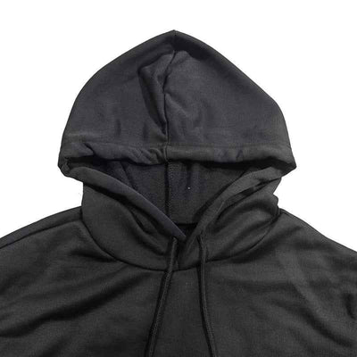Close-up of a black Hoodie Mini Dress featuring a stylish hood design and soft fabric