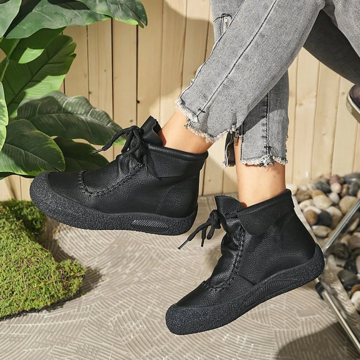 Trendsi black lace-up casual ankle boots worn with distressed gray jeans outdoors