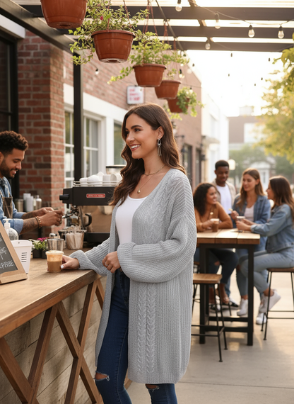 Light gray cable knit - brunette standing at cafe