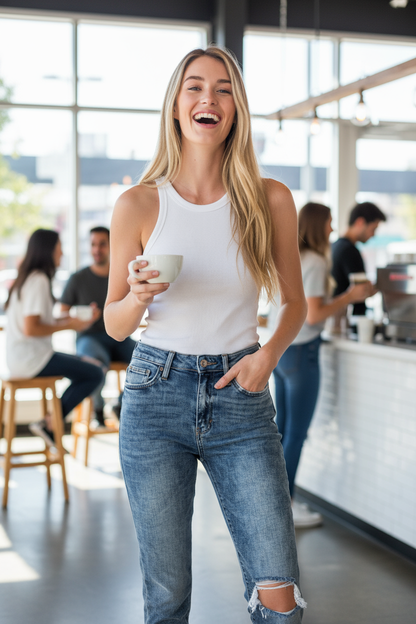 Light stone wash mom jeans at coffee shop - front view