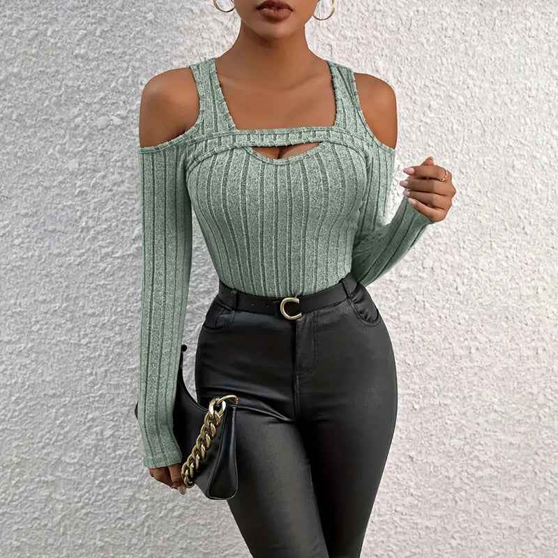 CJ Long Sleeve Top in green with cold shoulder design and cut-out detail, paired with stylish black pants