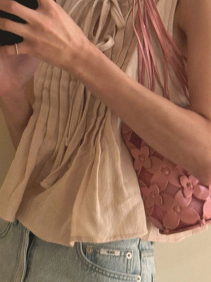 Trendsi beige Sleeveless Summer Blouse pleated front tie neckline with light wash jeans and pink floral bag