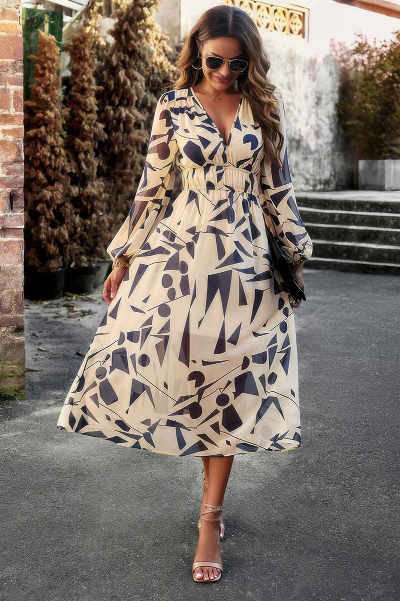 CCWHOLESALECLOTHING model wearing beige abstract print boho v neck dress with long sleeves and cinched waist