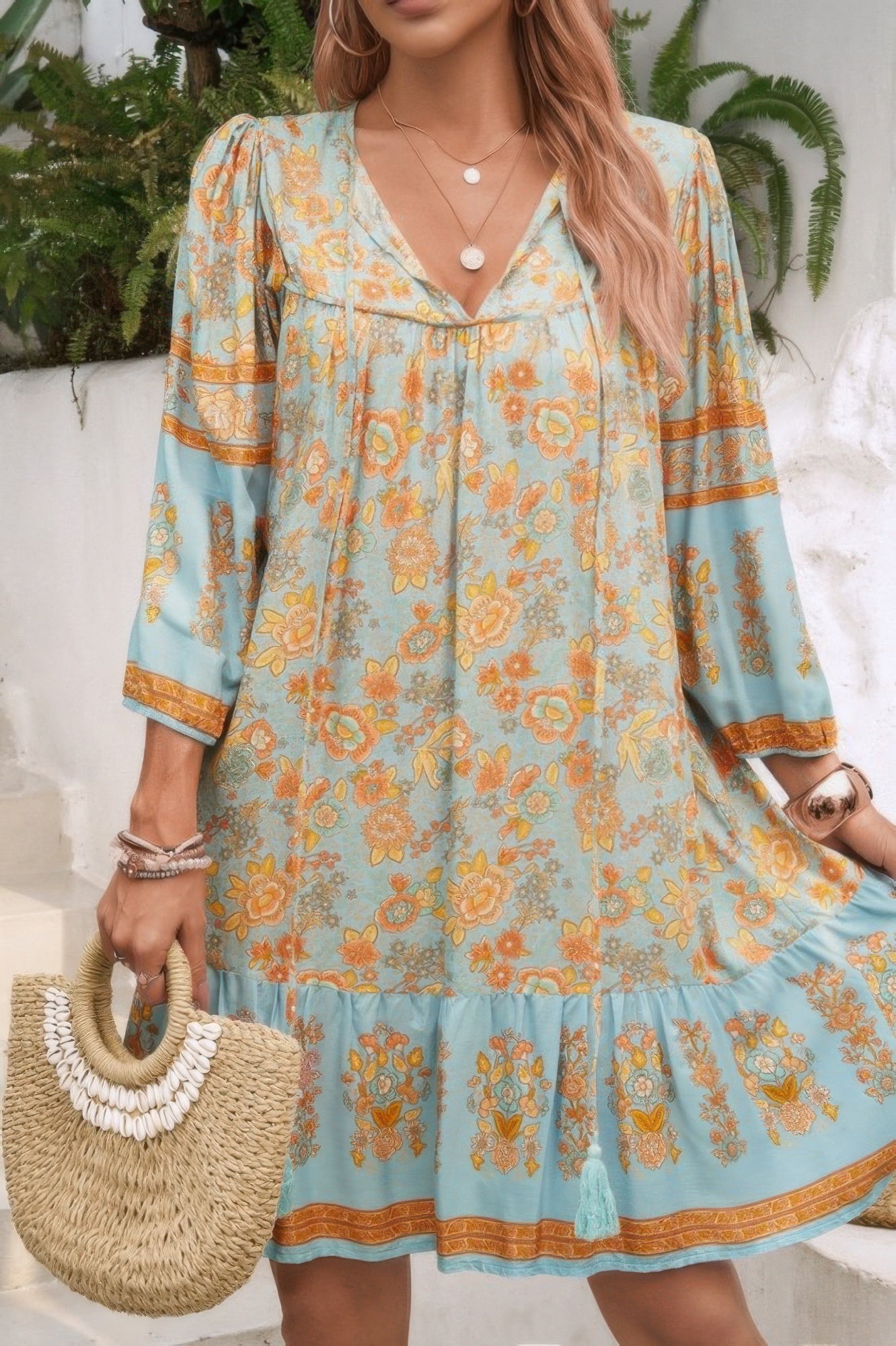 CCWHOLESALECLOTHING boho tassel v neck dress in sage blue floral print with flutter sleeves and tiered hem