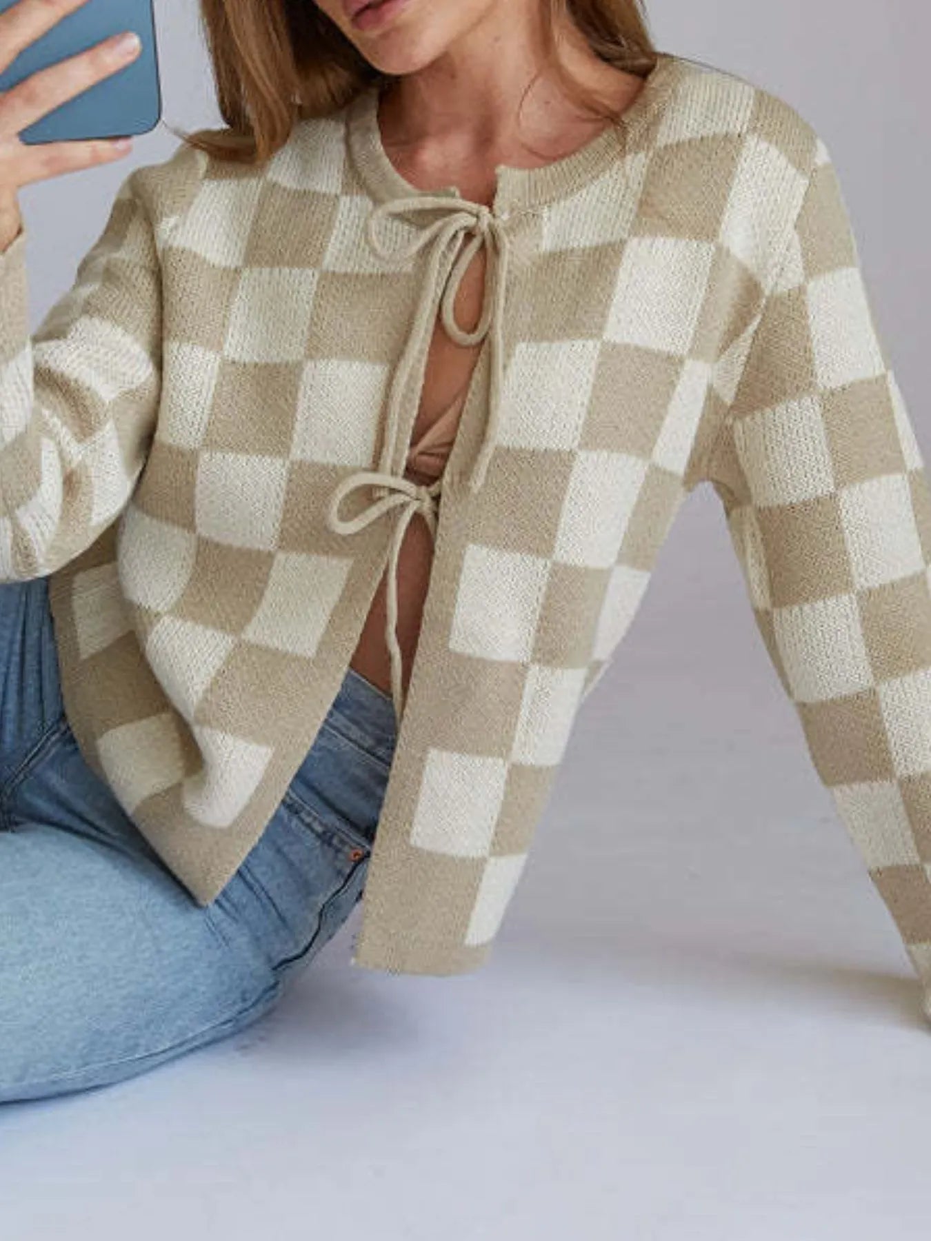 Trendsi Tie-Front Cropped Cardigan beige and white check knit sweater with front ties styled with jeans
